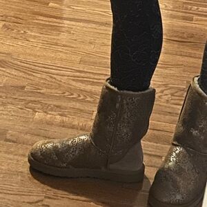 Ugg boots.  Tan color with metallic Ugg logo.  Barely worn.